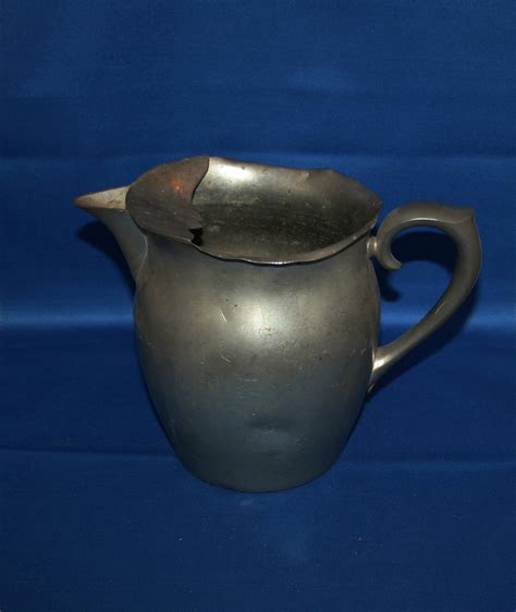 Serving Lemonade in a Pewter Pitcher